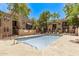 Sparkling community pool surrounded by lush greenery and comfortable lounge chairs at 747 S Extension Rd # 113, Mesa, AZ 85210