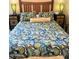 Comfortable bedroom with a patterned bedspread and nightstands with unique lamps at 7625 E Camelback Rd # B241, Scottsdale, AZ 85251