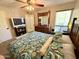 Inviting bedroom with a cozy bed, large mirror, and balcony access at 7625 E Camelback Rd # B241, Scottsdale, AZ 85251