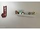 Fun decorative shelf with vintage exit sign and other collectibles at 7625 E Camelback Rd # B241, Scottsdale, AZ 85251