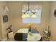 Dining area with a modern glass table, contemporary lighting, and unique decorations at 7625 E Camelback Rd # B241, Scottsdale, AZ 85251