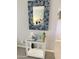 Stylish hallway with a decorative mirror and a mirrored side table with accessories at 7625 E Camelback Rd # B241, Scottsdale, AZ 85251