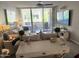 Cozy living room featuring a couch, TV, and a sliding glass door to a balcony at 7625 E Camelback Rd # B241, Scottsdale, AZ 85251