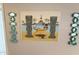 Retro painting of tropical scene with island style decor on the wall at 7625 E Camelback Rd # B241, Scottsdale, AZ 85251