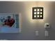 Wall decor featuring unique wall sconce, picture frame and thermostat at 7625 E Camelback Rd # B241, Scottsdale, AZ 85251