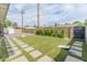 Large backyard featuring artificial grass, pavers, and outdoor seating areas at 7802 E Hubbell St, Scottsdale, AZ 85257