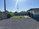 Spacious backyard includes a gravel area, artificial turf, and covered patio at 7802 E Hubbell St, Scottsdale, AZ 85257
