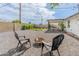 Inviting backyard features artificial grass, patio, fire pit, and comfortable seating, perfect for outdoor enjoyment at 7802 E Hubbell St, Scottsdale, AZ 85257