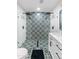 Modern bathroom with a large walk-in shower featuring vibrant tile and a rainfall showerhead at 7802 E Hubbell St, Scottsdale, AZ 85257
