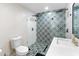 Updated bathroom featuring a patterned tile shower with glass enclosure, and modern fixtures at 7802 E Hubbell St, Scottsdale, AZ 85257