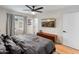 Bedroom with hardwood floors, ceiling fan, media cabinet, and a picture of the grand canyon at 7802 E Hubbell St, Scottsdale, AZ 85257