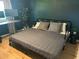 Comfortable bedroom with hardwood floors, neutral colors and a desk for work from home at 7802 E Hubbell St, Scottsdale, AZ 85257