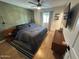 Comfortable bedroom with hardwood floors, a king bed, and soft natural light at 7802 E Hubbell St, Scottsdale, AZ 85257