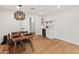 Dining area with access to a bar, featuring modern lighting and beautiful floors at 7802 E Hubbell St, Scottsdale, AZ 85257