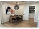 Cozy dining area featuring a modern light fixture, artwork, and seating for four at 7802 E Hubbell St, Scottsdale, AZ 85257