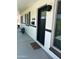 Charming front door featuring a black door and white painted brick with great curb appeal at 7802 E Hubbell St, Scottsdale, AZ 85257