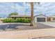 Charming single-story home with a manicured front yard and attached two-car garage at 7802 E Hubbell St, Scottsdale, AZ 85257