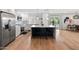 Bright kitchen with stainless steel appliances, a large island, and sleek white cabinetry at 7802 E Hubbell St, Scottsdale, AZ 85257