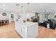 Open-concept kitchen with barstool seating at the island and hardwood floors throughout at 7802 E Hubbell St, Scottsdale, AZ 85257