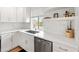 Well-lit kitchen featuring white cabinets, stainless steel appliances, and a garden view at 7802 E Hubbell St, Scottsdale, AZ 85257