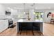 Stylish kitchen featuring an island with seating, stainless steel appliances, and lots of natural light at 7802 E Hubbell St, Scottsdale, AZ 85257