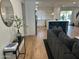 Open living room and kitchen with hardwood floors, modern decor and kitchen island at 7802 E Hubbell St, Scottsdale, AZ 85257