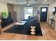 Stylish living room with hardwood floors, a large sectional, and a modern entertainment center at 7802 E Hubbell St, Scottsdale, AZ 85257