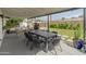 Inviting outdoor patio with comfortable seating and a view of the backyard at 7802 E Hubbell St, Scottsdale, AZ 85257