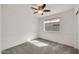 Bedroom with laminate floors, chair rail, ceiling fan, and bright window at 8009 W Salter Dr, Peoria, AZ 85382