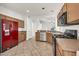 Well-lit kitchen featuring stainless steel appliances, light wood cabinets, and tile floors at 8009 W Salter Dr, Peoria, AZ 85382