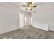 Spacious main bedroom featuring carpeted floors, a ceiling fan, and neutral paint at 8009 W Salter Dr, Peoria, AZ 85382