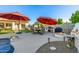 Outdoor space features a dining area, grill, fire pit, and lush landscaping, perfect for enjoying the outdoors at 8132 W Hatfield Rd, Peoria, AZ 85383