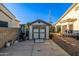 Backyard shed area with exterior access and nearby patio at 8132 W Hatfield Rd, Peoria, AZ 85383
