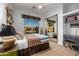 Bright bedroom with large window and stylish decor at 8132 W Hatfield Rd, Peoria, AZ 85383
