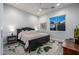 Comfortable bedroom with a ceiling fan, window, and lamps at 8132 W Hatfield Rd, Peoria, AZ 85383