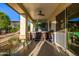 Covered patio featuring a hot tub and outdoor seating, perfect for relaxation and enjoying the backyard view at 8132 W Hatfield Rd, Peoria, AZ 85383