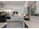 Gourmet kitchen featuring white cabinets, stainless steel appliances, and granite countertops at 8132 W Hatfield Rd, Peoria, AZ 85383