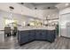 Stylish kitchen island with grey cabinets and barstool seating at 8132 W Hatfield Rd, Peoria, AZ 85383