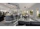 Open-concept kitchen and dining area featuring modern countertops, seating, and natural light at 8132 W Hatfield Rd, Peoria, AZ 85383