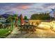 Cozy outdoor dining area with comfortable seating, grill, and fire pit, perfect for entertaining guests at 8132 W Hatfield Rd, Peoria, AZ 85383