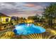 Backyard pool with a patio, firepit, mature landscaping, and privacy fence at 8132 W Hatfield Rd, Peoria, AZ 85383