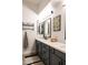 Modern bathroom with dual vanity, decorative mirror, and white countertops at 8132 W Hatfield Rd, Peoria, AZ 85383