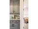 Gray cabinets with matching countertops with view of bedroom at 8132 W Hatfield Rd, Peoria, AZ 85383