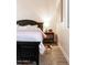 Bedroom with a dark wood bed frame and a patterned rug, offering a cozy retreat at 8132 W Hatfield Rd, Peoria, AZ 85383