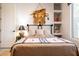 Bedroom with Southwestern decor, including a unique headboard and a patterned blanket at 8132 W Hatfield Rd, Peoria, AZ 85383