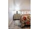 Bedroom with decorative bedding and a vintage-style nightstand lamp at 8132 W Hatfield Rd, Peoria, AZ 85383