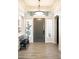 Entryway features a modern front door flanked by glass block windows and a bench at 8132 W Hatfield Rd, Peoria, AZ 85383