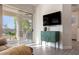 Bright living room with modern decor, sliding glass doors, and hardwood floors at 8132 W Hatfield Rd, Peoria, AZ 85383