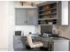 Functional home office featuring custom cabinetry, drawers, shelves and a printer station at 8132 W Hatfield Rd, Peoria, AZ 85383