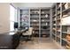 Cozy home office with custom built-in bookshelves and a comfortable desk area at 8132 W Hatfield Rd, Peoria, AZ 85383